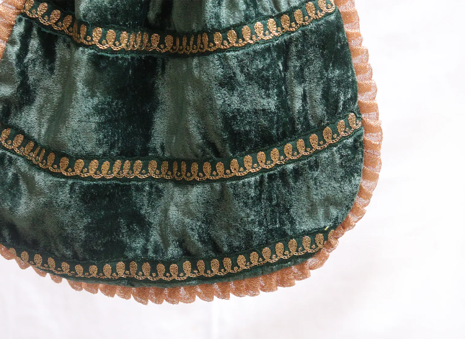 Dark green velvet potli with gold jari embroidery